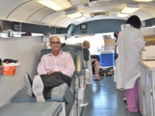 Dr. LoPour donating blood to United Blood Services