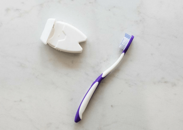 Toothpaste and Floss on Counter