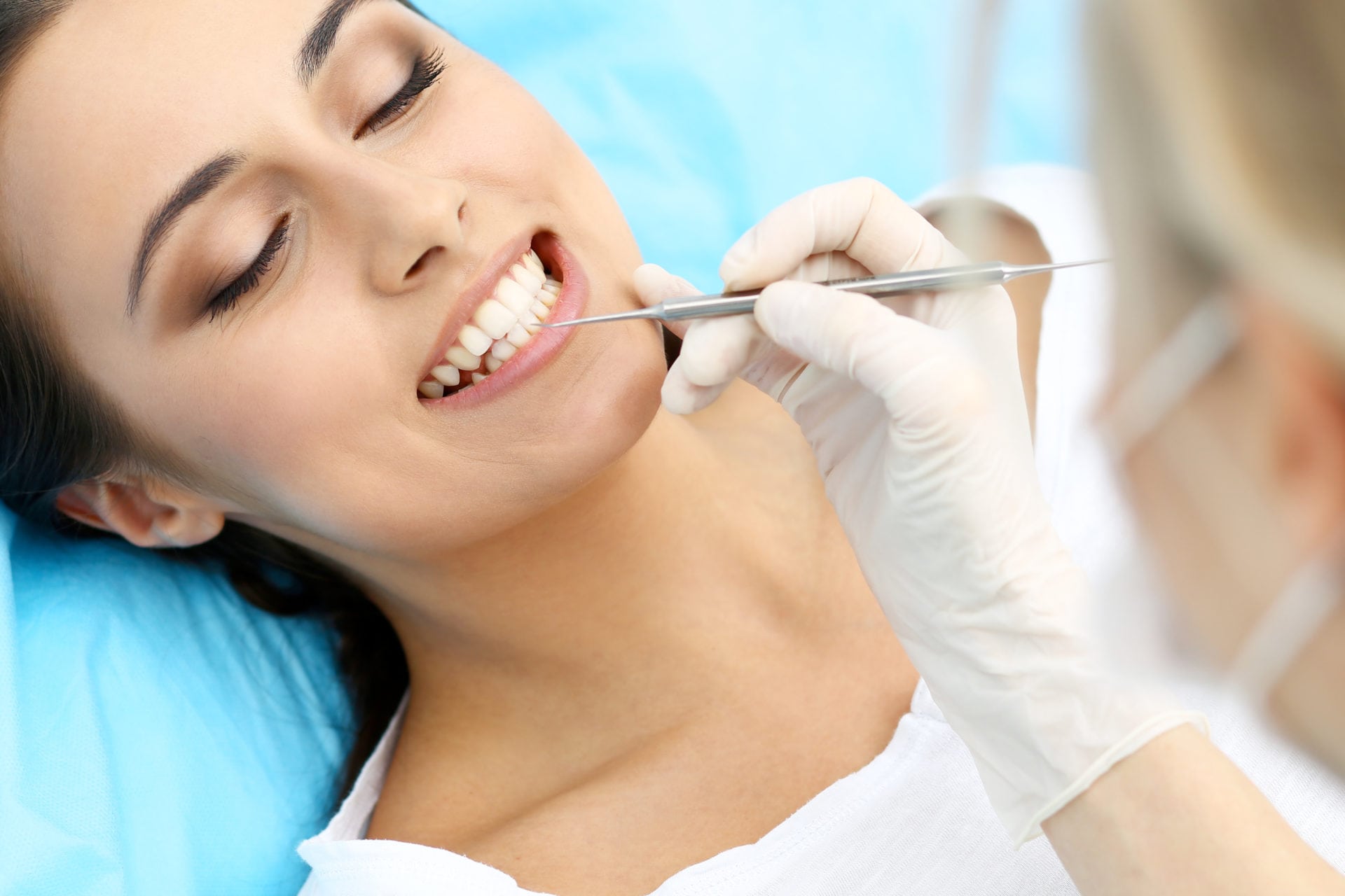 woman receiving dental exam albuquerque dentist